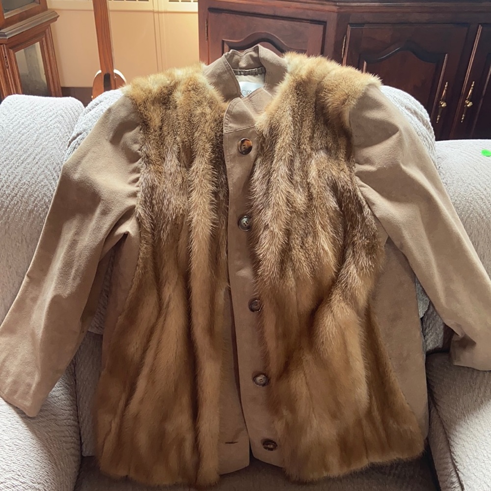 This is a light brown vintage fur coat